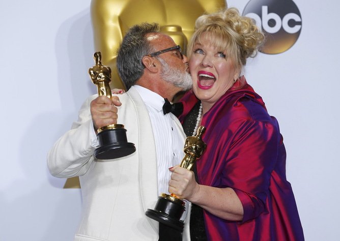 Colin Gibson and Lisa Thompson, winners of Best Production Design for "Mad Max: Fury Road", react during the 88th Academy Awards in Hollywood, California February 28, 2016.  REUTERS/Mike Blake       TPX IMAGES OF THE DAY - RTS8H5Q